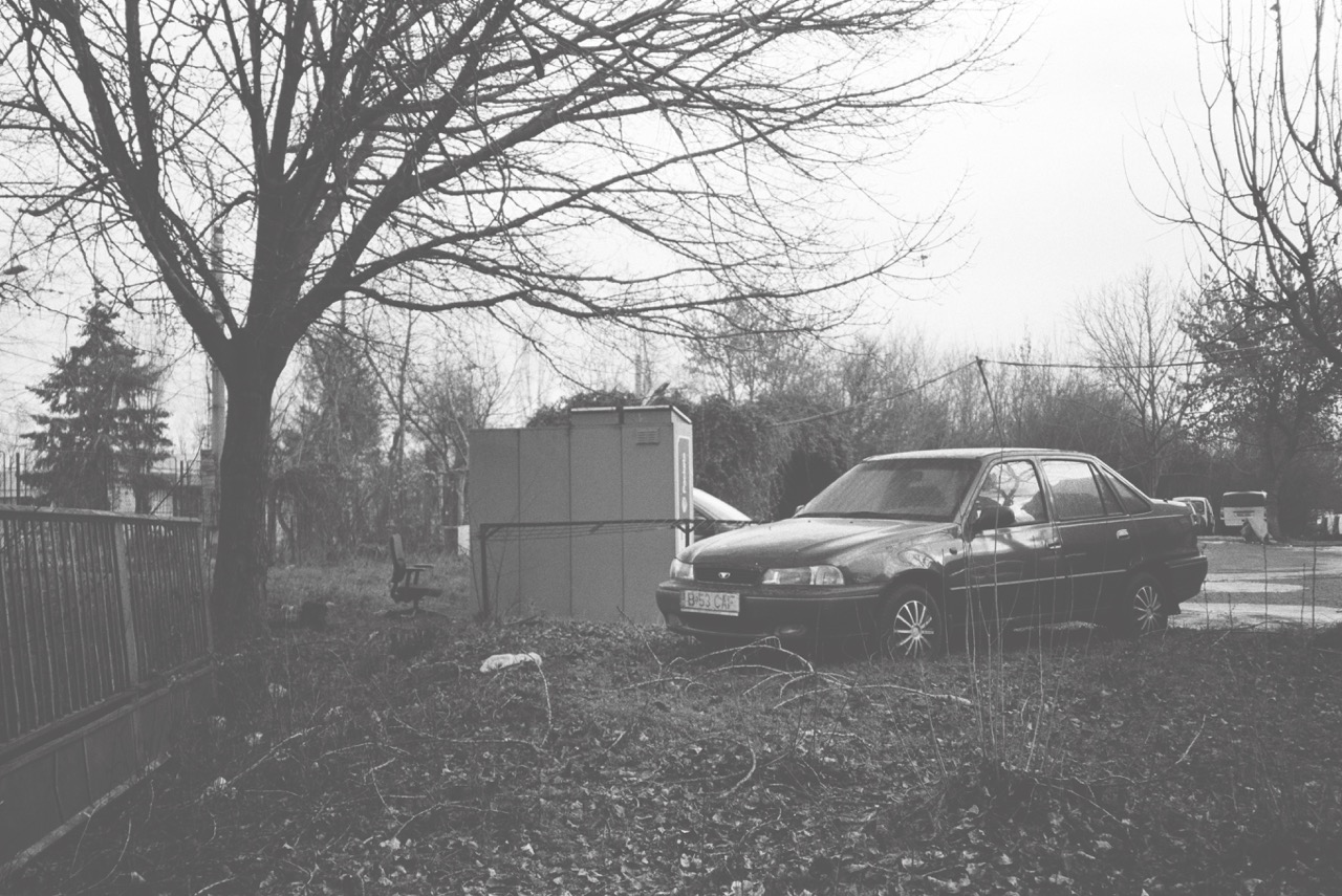 Old car in front of the former factories of Pipera